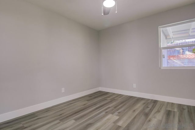 unfurnished room with ceiling fan and light hardwood / wood-style floors