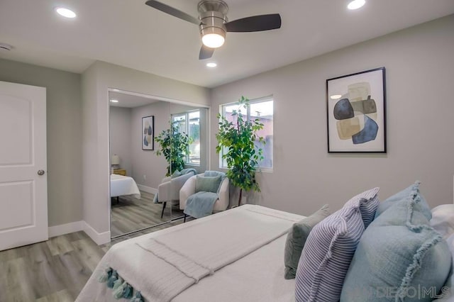 bedroom featuring ceiling fan and light wood-type flooring