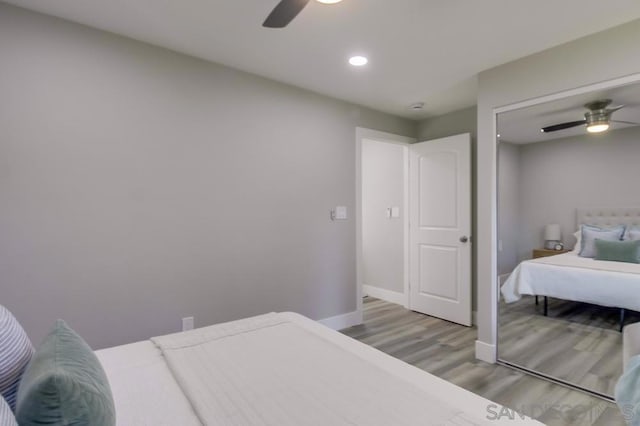 bedroom featuring wood-type flooring and ceiling fan