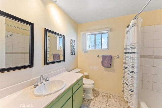 full bathroom featuring toilet, vanity, and shower / tub combo with curtain