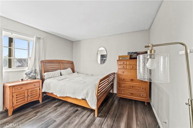 bedroom featuring dark wood-type flooring