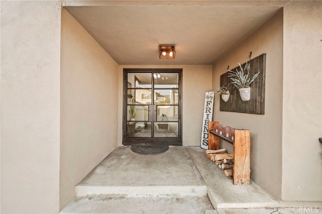 view of exterior entry featuring french doors