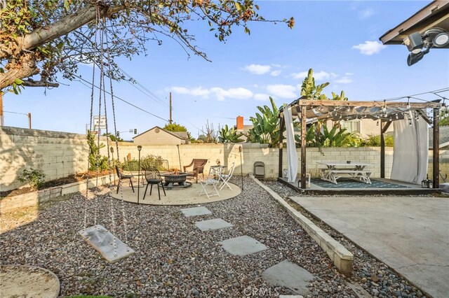 view of yard with a patio area and a fire pit