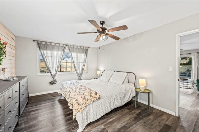 bedroom featuring ceiling fan and dark hardwood / wood-style flooring