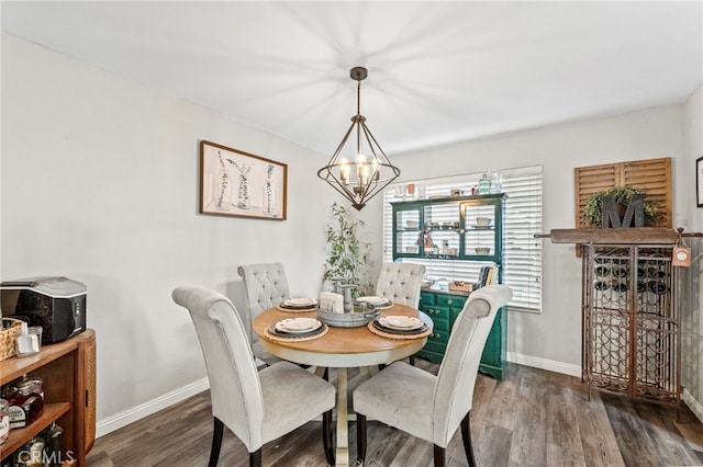 dining room featuring a notable chandelier and dark hardwood / wood-style flooring