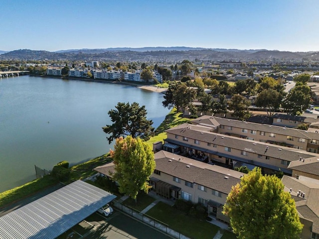 birds eye view of property featuring a water and mountain view