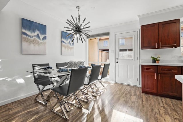 dining area with crown molding, dark hardwood / wood-style floors, and a notable chandelier