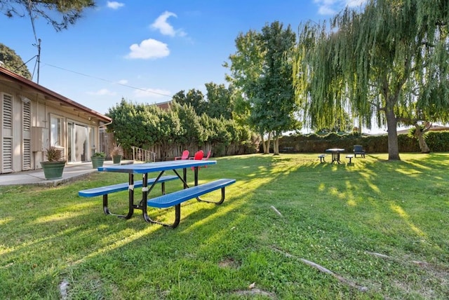 view of home's community featuring a lawn