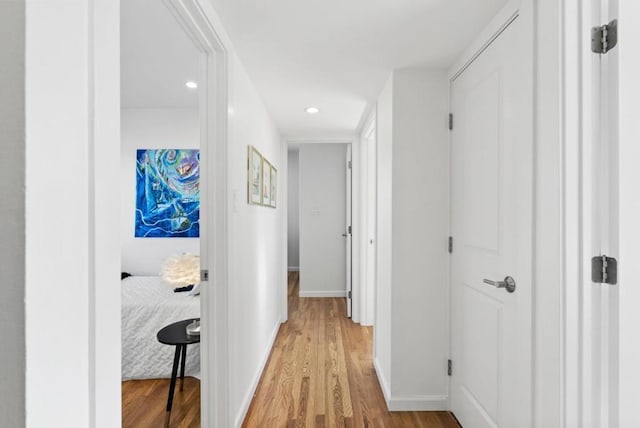 hall with light hardwood / wood-style flooring