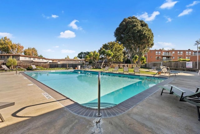 view of swimming pool with a patio area