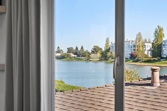 doorway to outside featuring a water view