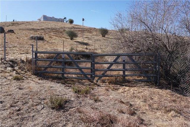 view of gate featuring a rural view