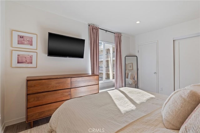 bedroom with wood-type flooring