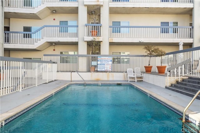 view of pool featuring a patio