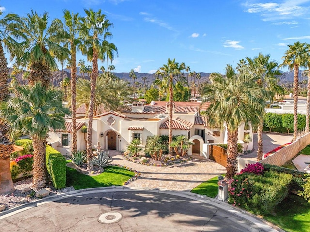 mediterranean / spanish house featuring a mountain view