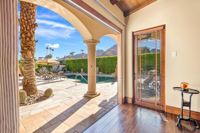 view of patio / terrace with a mountain view and a fenced in pool