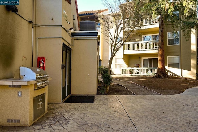 view of property featuring central AC unit