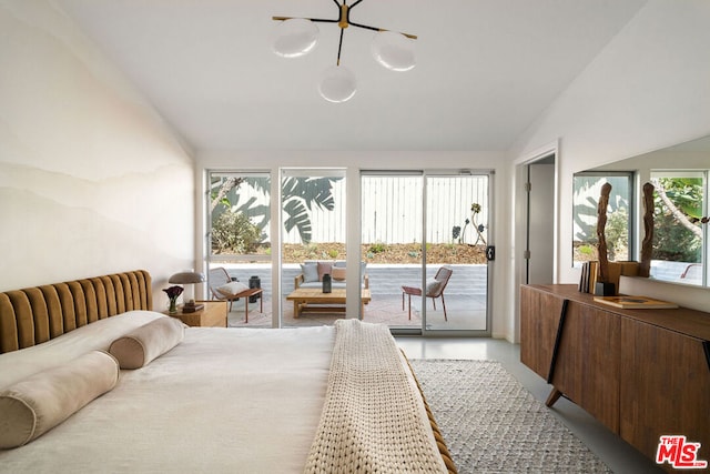 bedroom featuring access to exterior and lofted ceiling