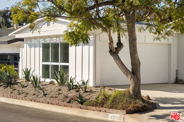 view of side of property featuring a garage