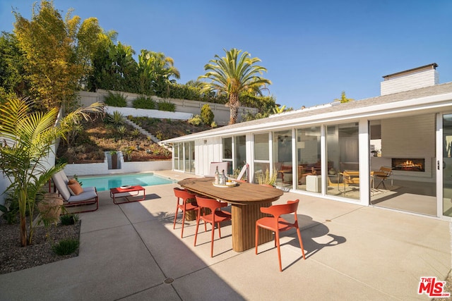 view of patio with a fenced in pool