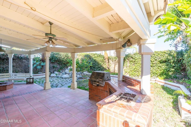 view of patio with ceiling fan and area for grilling