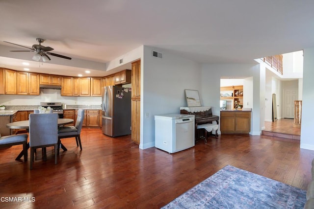 kitchen with built in shelves, ceiling fan, stainless steel appliances, and dark hardwood / wood-style flooring