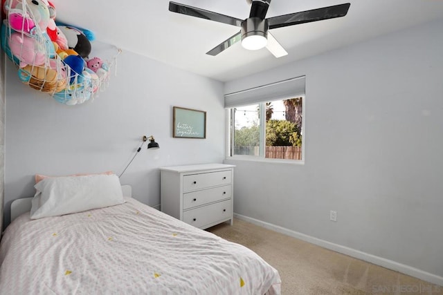 bedroom featuring ceiling fan and light colored carpet