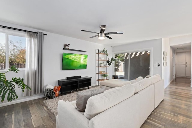 living room with hardwood / wood-style floors and ceiling fan