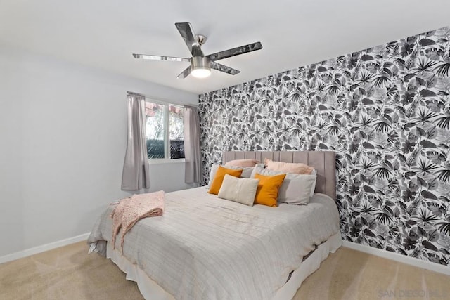 bedroom with ceiling fan and light colored carpet