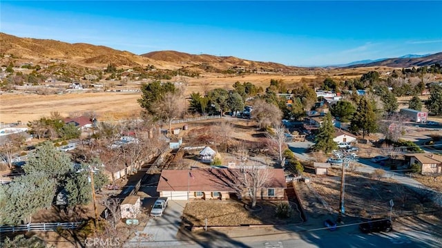 birds eye view of property featuring a mountain view