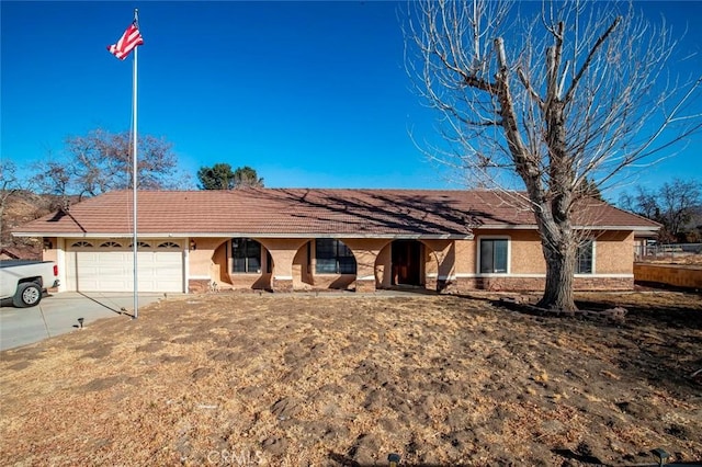 single story home featuring a garage