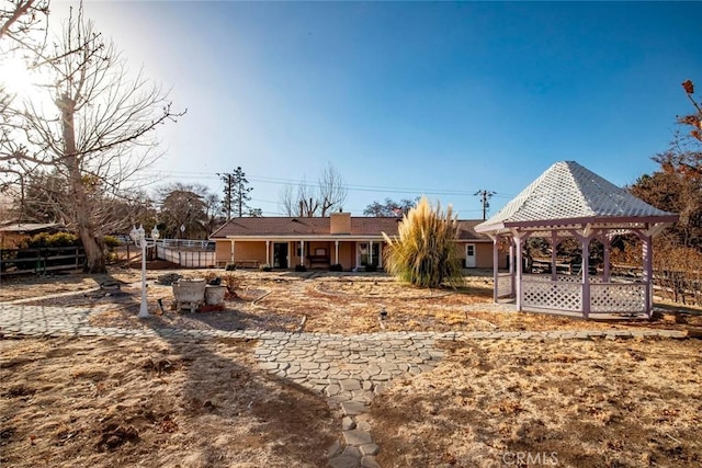 rear view of house with a gazebo