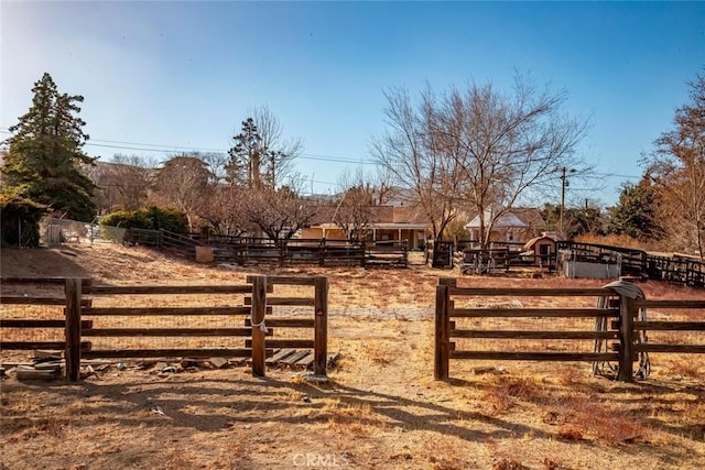 view of gate featuring a rural view