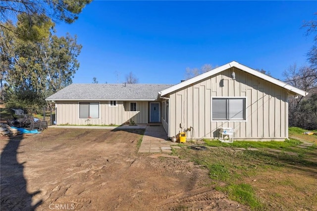 back of house featuring board and batten siding