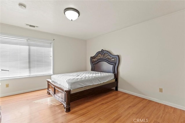 bedroom featuring light hardwood / wood-style floors