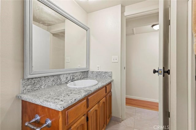 bathroom with tile patterned flooring and vanity