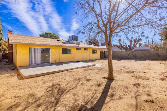 back of property with a patio area and cooling unit