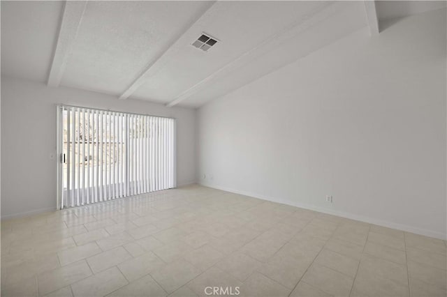 spare room with lofted ceiling with beams