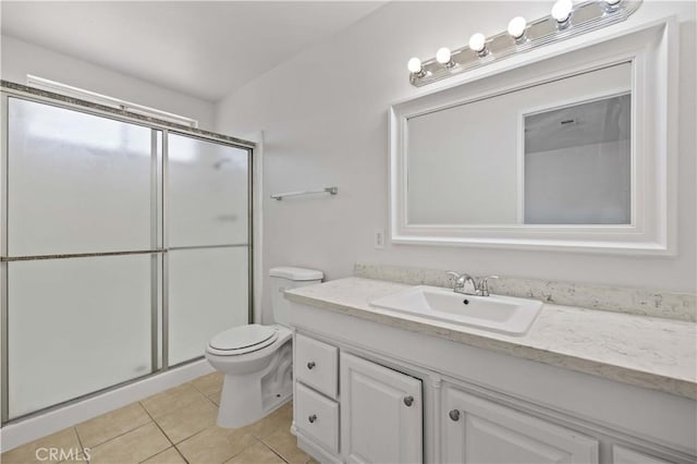 bathroom featuring a shower with door, toilet, tile patterned floors, and vanity