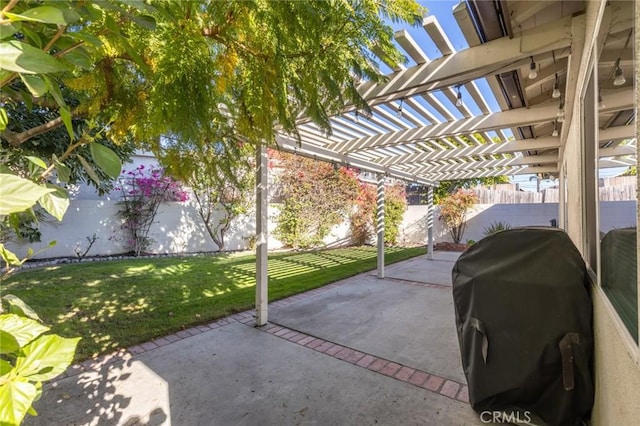 view of patio featuring a pergola and a grill