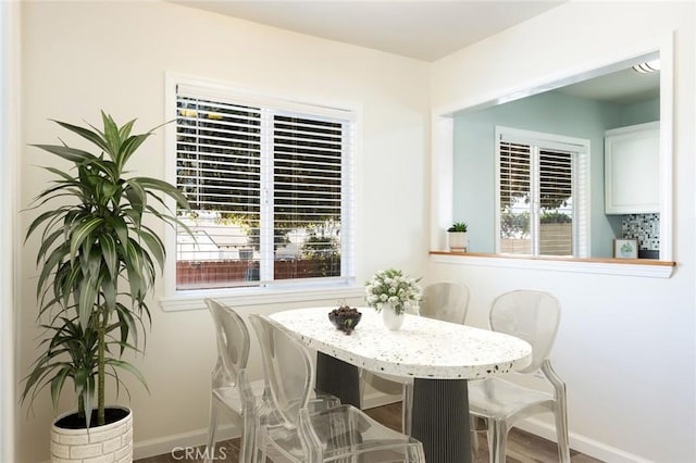 dining area with wood-type flooring