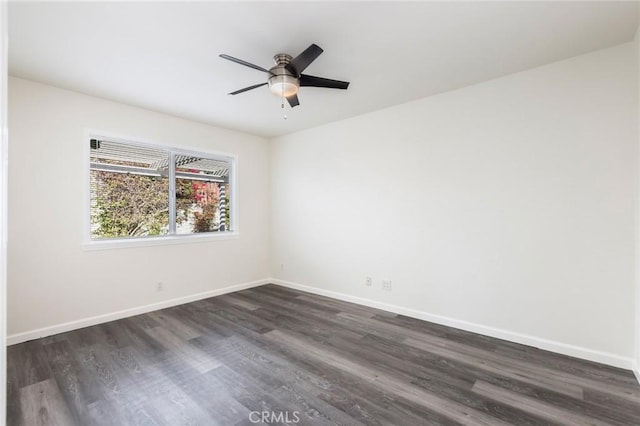 unfurnished room with ceiling fan and dark wood-type flooring