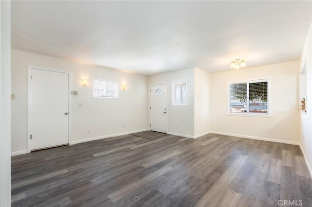 foyer entrance with plenty of natural light and dark wood-type flooring