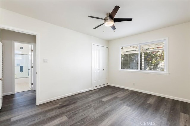 unfurnished bedroom featuring a closet, ceiling fan, and dark hardwood / wood-style flooring