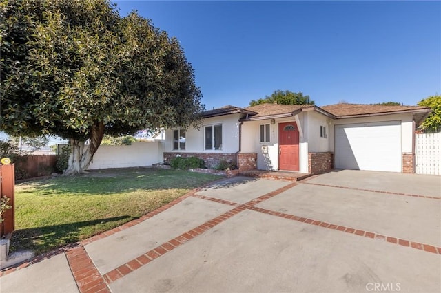 view of front of home with a garage and a front yard