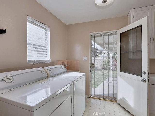 laundry area with plenty of natural light and washer and clothes dryer