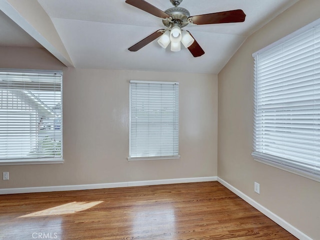 unfurnished room featuring light wood-type flooring, vaulted ceiling, and ceiling fan