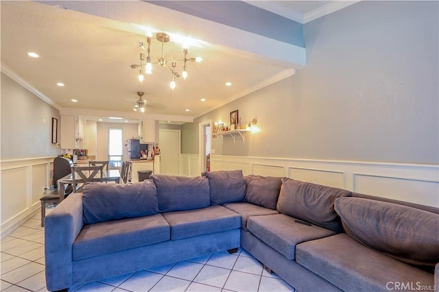 living room with an inviting chandelier, light tile patterned floors, and ornamental molding