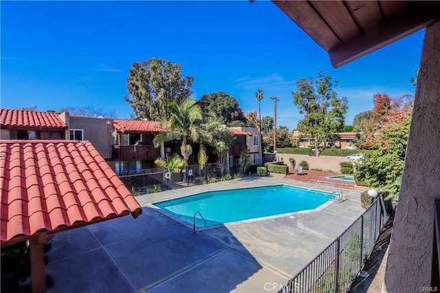 view of swimming pool with a patio area