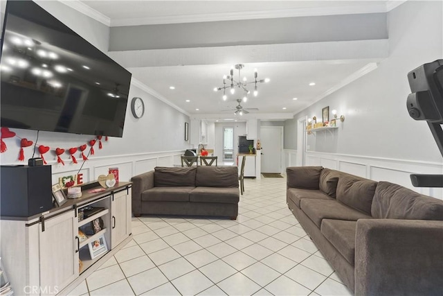 living room featuring ceiling fan with notable chandelier, light tile patterned floors, and crown molding